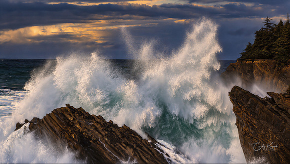 Massive Pacific Ocean Wave Exploding Against Rocky Cliffs Under